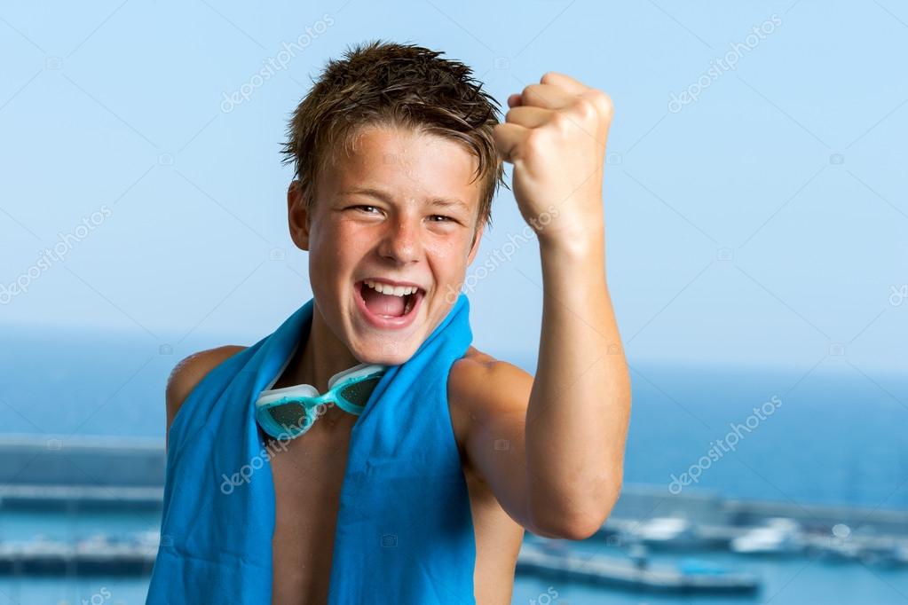 Champion teen pulling a fist. Stock Photo by ©karelnoppe