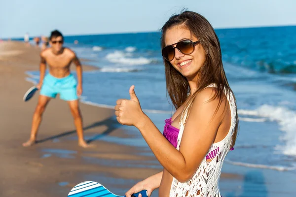 Cute beach tennis player doing thumbs up. — Stock Photo, Image