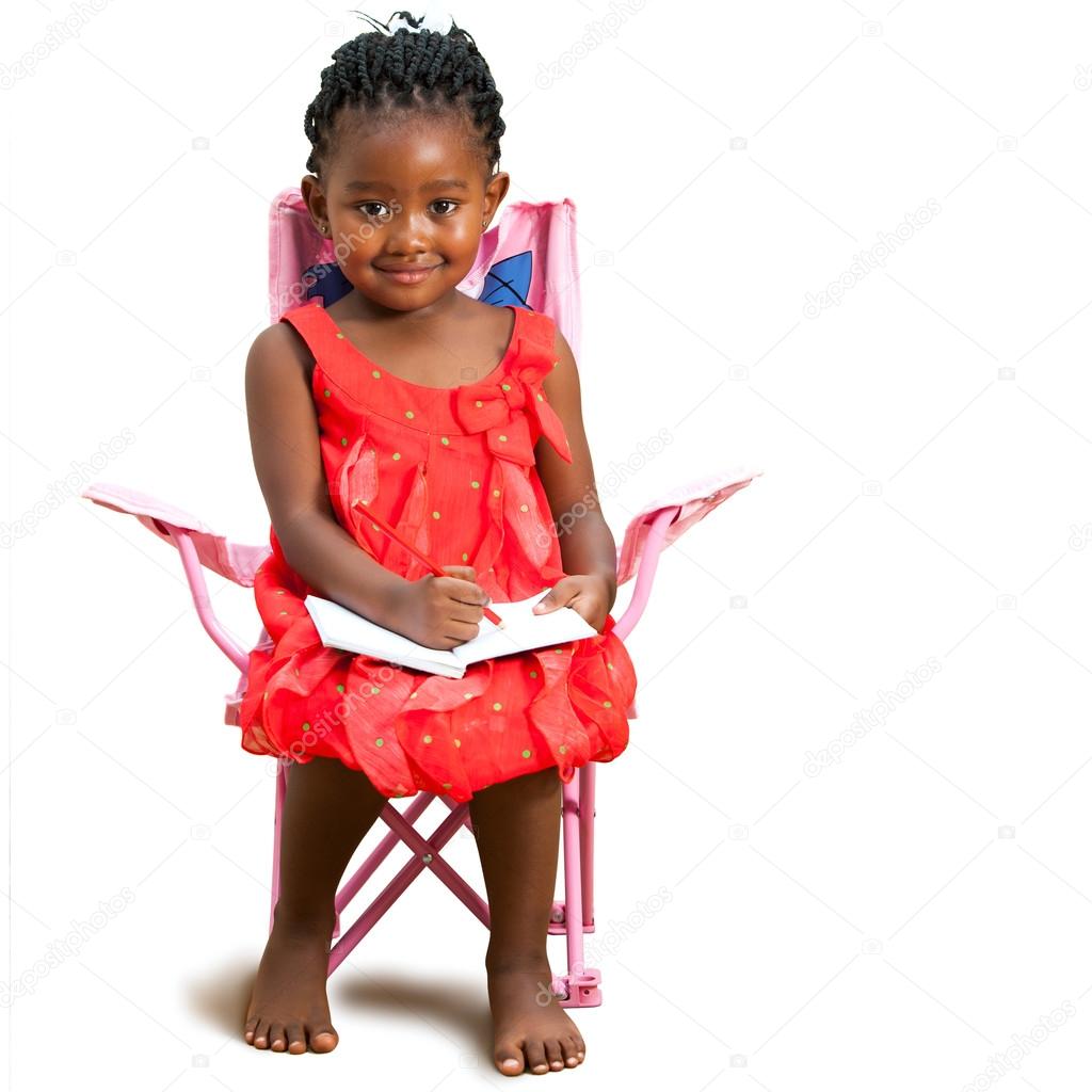 African youngster with note book.