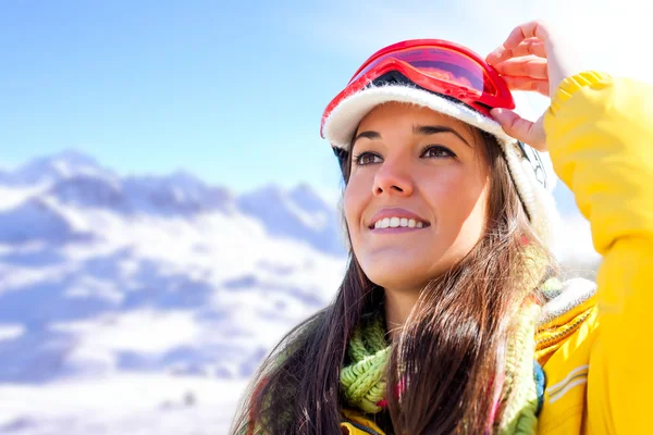 Woman in ski wear contemplating view. — Stock Photo, Image