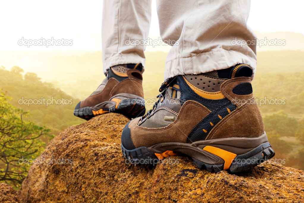 Close up of hiker boots on rocks.