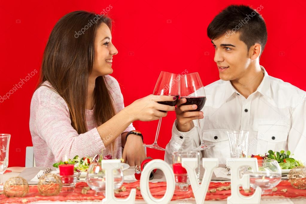 Young couple celebrating valentine's over dinner.