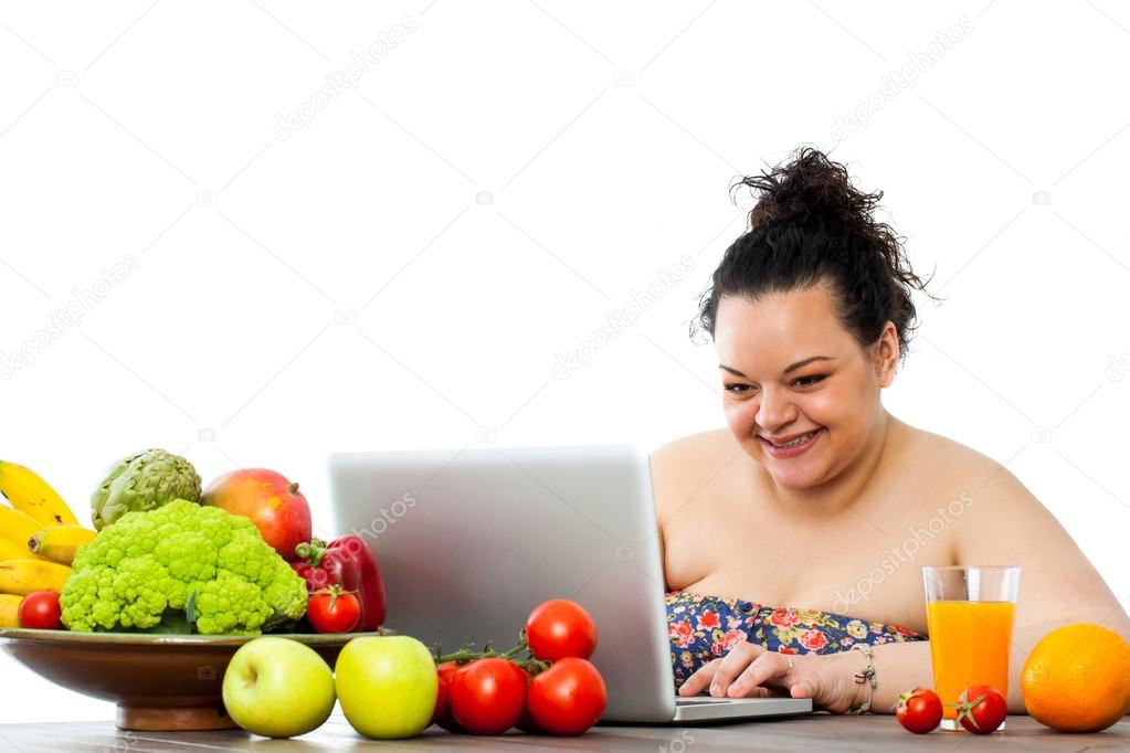 Overweight girl consulting diet on laptop.