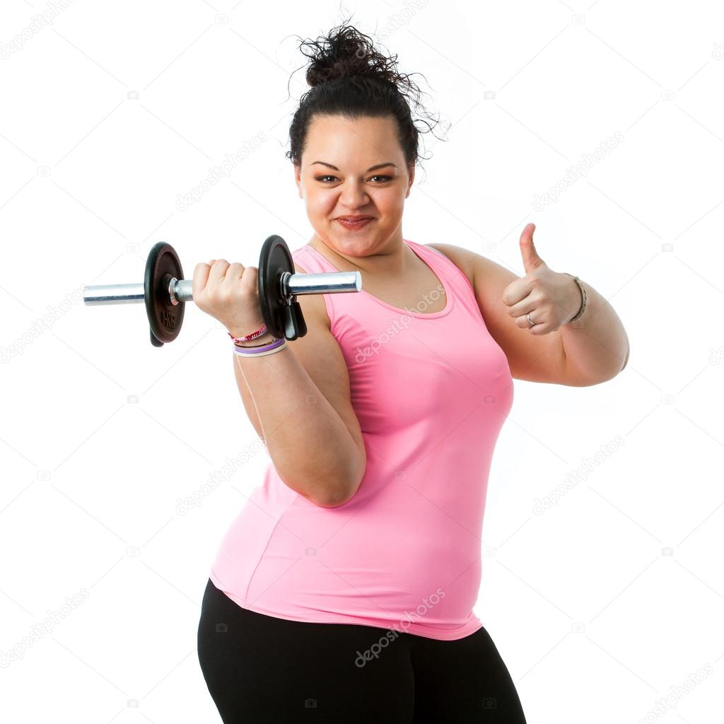 Overweight fitness girl doing thumbs up.