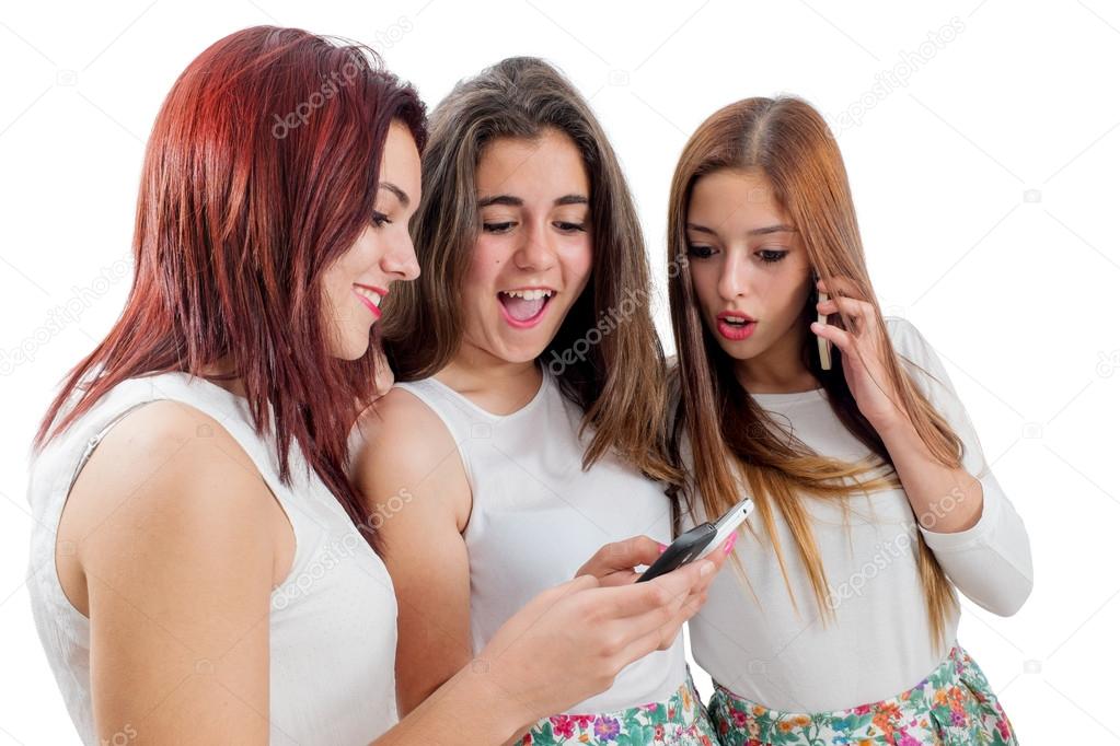 Teen girlfriends playing on smart phones