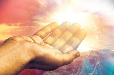 Macro close up of healing hand reaching out to sky. Spiritual heavenly concept. clipart