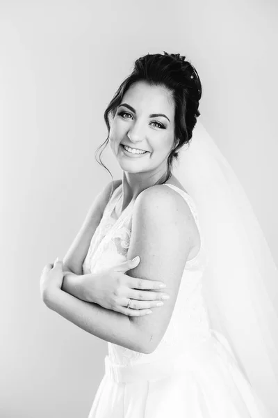 Pretty Bride Hugs Herself Looks Camera Background Wall — Stockfoto
