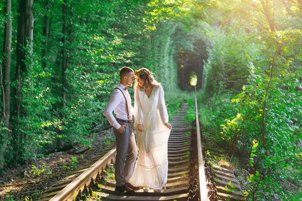 Couple Festive Clothing Standing Railway Smile Green Tree Tunnel — Zdjęcie stockowe