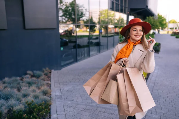 Image Happy Woman Paper Bags Walking Street — стоковое фото