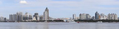 Chinese city of Harbin on the river Songhua clipart