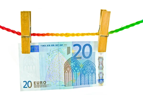 Euro-penger hengende med treklesplugg – stockfoto
