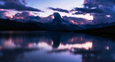Beautiful scenery in the Swiss Alps in summer, with Matterhorn peak in the background