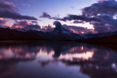 Beautiful scenery in the Swiss Alps in summer, with Matterhorn peak in the background