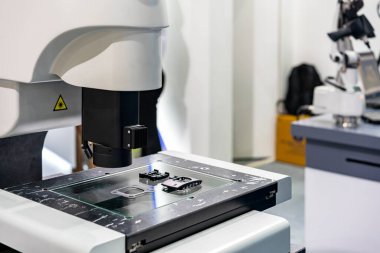 workpiece during inspection dimension shape appearance etc. by high technology precision video measuring machine with visual camera for quality control of manufacturing process