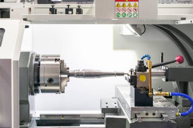 metal steel product part set on spindle chuck and tail stock of high precision cnc lathe turning machine in industrial