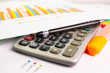 document color graph sheet for presentation at the office with equipment calculator, pen, color pen highlight