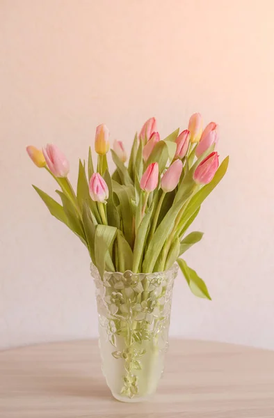 Bouquet Colorful Young Spring Tulips Wrapped Glass Vase Table — Stock Photo, Image