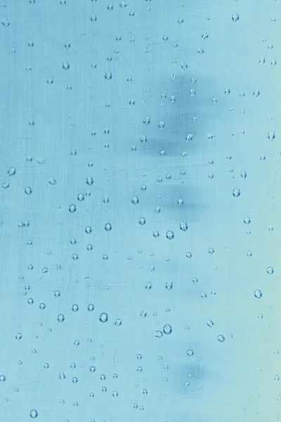 Abstrakt textur: droppar vatten på blå bakgrund — Stockfoto