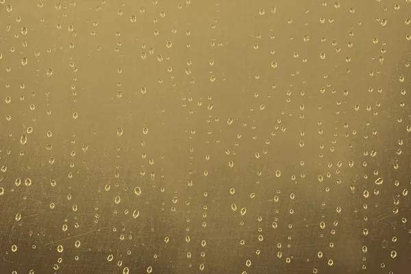 Textura abstrata: gotas de água sobre fundo de ouro marrom — Fotografia de Stock