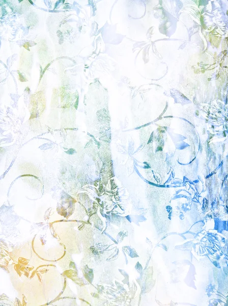 Dokulu arka plan: beyaz zemin üzerinde mavi, sarı ve yeşil çiçek desenleri — Stok fotoğraf