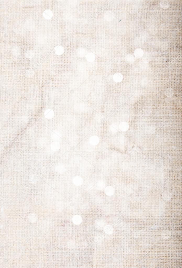 Abstract textured background: pink old canvas with white bokeh-like patterns