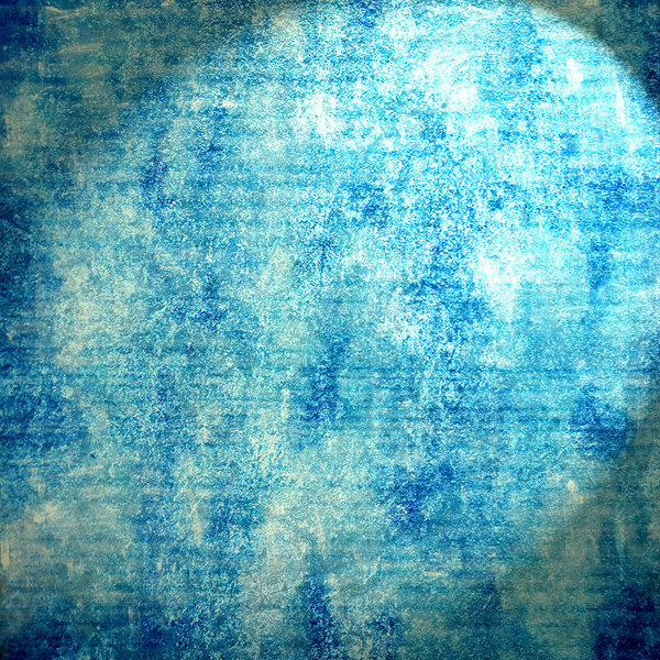 Abstract blue background or paper with bright center spotlight and dark border frame with grunge background texture