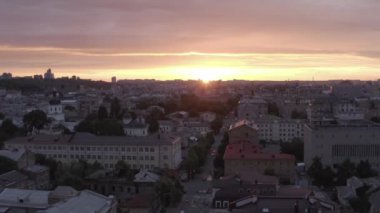 Podol is an old district of the city of Kyiv. Sunset. Summer. Roofs of houses. Aerial. ity skyline