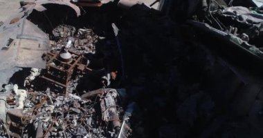 Destroyed military convoy. Burnt combat vehicles. Rusty tech. Consequences of an artillery strike. War in Ukraine. Bucha.