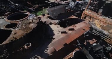 Destroyed military convoy. Burnt combat vehicles. Rusty tech. Consequences of an artillery strike. War in Ukraine. Bucha.