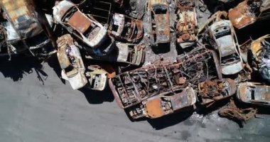 Technology cemetery. Abandoned cars of civilians during the evacuation of the city during the bombing of the city of Bucha. War in Ukraine. Aerial