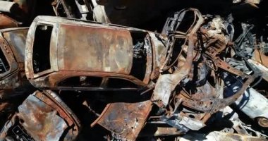 Technology cemetery. Abandoned cars of civilians during the evacuation of the city during the bombing of the city of Bucha. War in Ukraine. Aerial