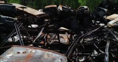 Technology cemetery. Abandoned cars of civilians during the evacuation of the city during the bombing of the city of Bucha. War in Ukraine. Aerial