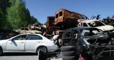 Technology cemetery. Abandoned cars of civilians during the evacuation of the city during the bombing of the city of Bucha. War in Ukraine. Aerial