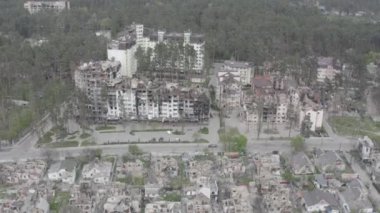Destruction after an air strike on residential buildings of civilians. War in Ukraine. Destroyed houses. Aerial. Irpin City. 