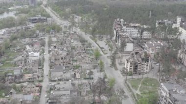 Destruction after an air strike on residential buildings of civilians. War in Ukraine. Destroyed houses. Aerial. Irpin City. 