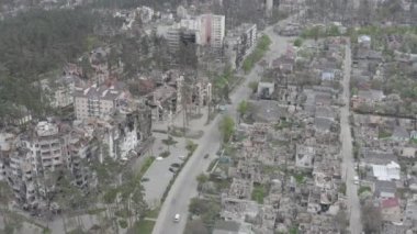 Destruction after an air strike on residential buildings of civilians. War in Ukraine. Destroyed houses. Aerial. Irpin City. 