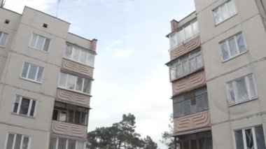 Damaged residential building in the Bucha city, Kyiv region during the fighting after the Russian attack on Ukraine. Russian-Ukrainian war. Aerial. Fire in the house. 