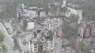 Destruction after an air strike on residential buildings of civilians. War in Ukraine. Destroyed houses. Aerial. Irpin City. 