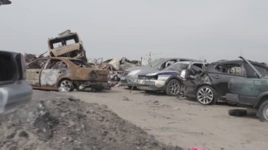 Cemetery of destroyed cars after the evacuation of the inhabitants of the city of Bucha. Ukraine. Grod Bucha. War in Ukraine. Shot cars.