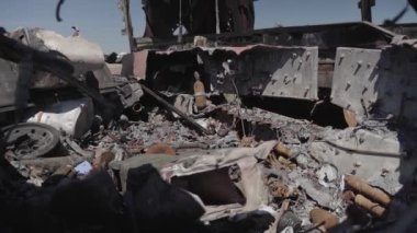 Burnt military equipment after a missile attack. Abandoned rusty military equipment. City of Irpin. Ukraine. War.
