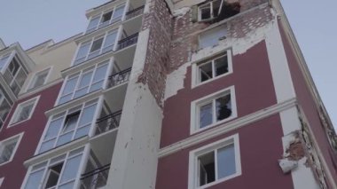 Damaged residential building in the Bucha city, Kyiv region during the fighting after the Russian attack on Ukraine. Russian-Ukrainian war. Aerial. Fire in the house.