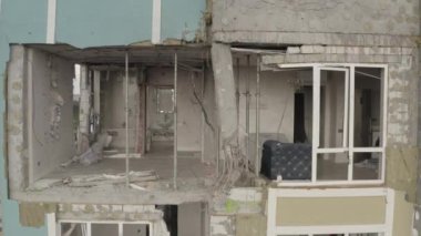 A bombed-out modern residential building in the city of Bucha. Aerial. War in Ukraine. Russian aggression. Destroyed apartments of residents from shells.