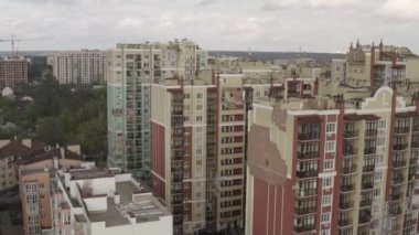 A bombed-out modern residential building in the city of Bucha. Aerial. War in Ukraine. Russian aggression. Destroyed apartments of residents from shells.