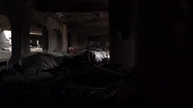 The apartment of the inhabitants after the evacuation during the bombing of a peaceful city. Left belongings of residents. Bombed apartments. Fire in the house. Traces of hits from. Irpin. Ukraine.