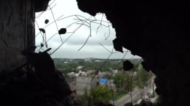 The apartment of the inhabitants after the evacuation during the bombing of a peaceful city. Left belongings of residents. Bombed apartments. Fire in the house. Traces of hits from. Irpin. Ukraine.