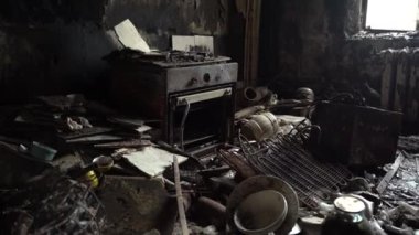 The apartment of the inhabitants after the evacuation during the bombing of a peaceful city. Left belongings of residents. Bombed apartments. Fire in the house. Traces of hits from. Irpin. Ukraine.