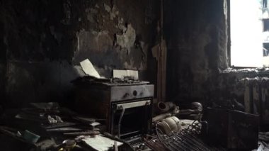 The apartment of the inhabitants after the evacuation during the bombing of a peaceful city. Left belongings of residents. Bombed apartments. Fire in the house. Traces of hits from. Irpin. Ukraine.