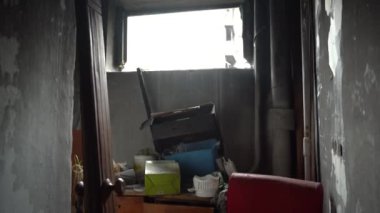 The apartment of the inhabitants after the evacuation during the bombing of a peaceful city. Left belongings of residents. Bombed apartments. Fire in the house. Traces of hits from. Irpin. Ukraine.