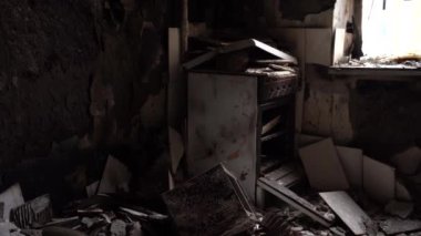 The apartment of the inhabitants after the evacuation during the bombing of a peaceful city. Left belongings of residents. Bombed apartments. Fire in the house. Traces of hits from. Irpin. Ukraine.