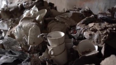 The apartment of the inhabitants after the evacuation during the bombing of a peaceful city. Left belongings of residents. Bombed apartments. Fire in the house. Traces of hits from. Irpin. Ukraine.